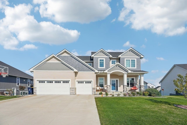 craftsman-style home featuring a front lawn, a porch, and a garage