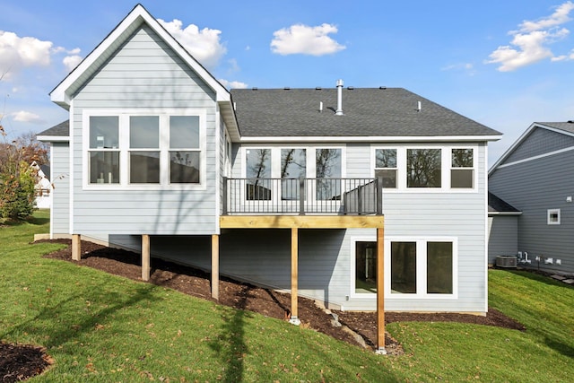 rear view of house featuring a yard, central AC unit, and a deck