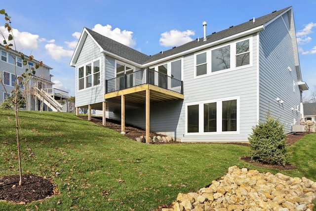 rear view of house featuring a lawn