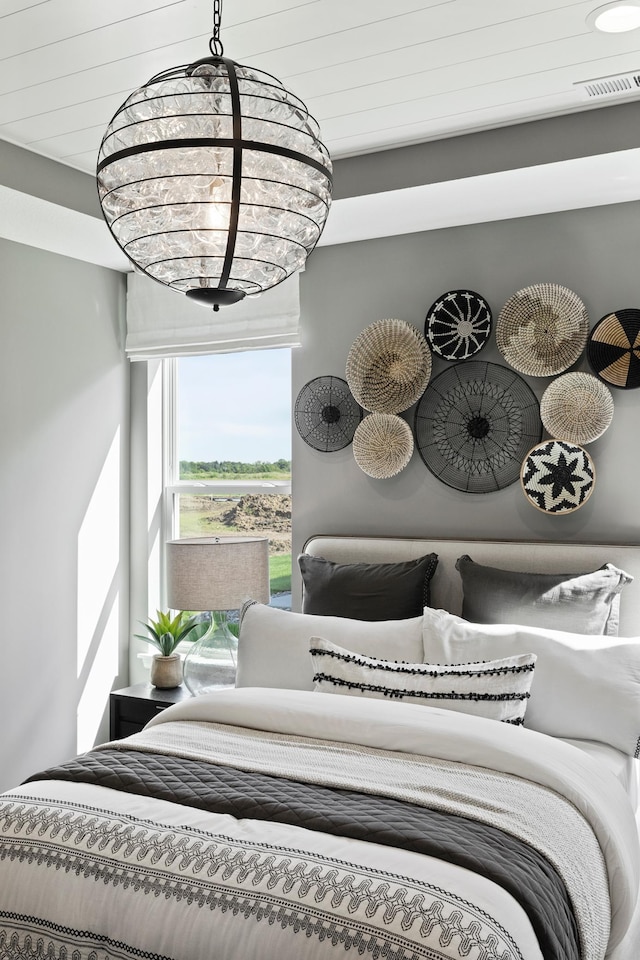 bedroom featuring a chandelier