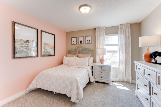 carpeted bedroom with a textured ceiling