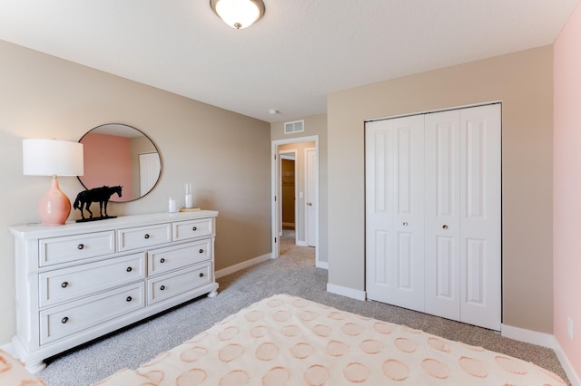 carpeted bedroom featuring a closet