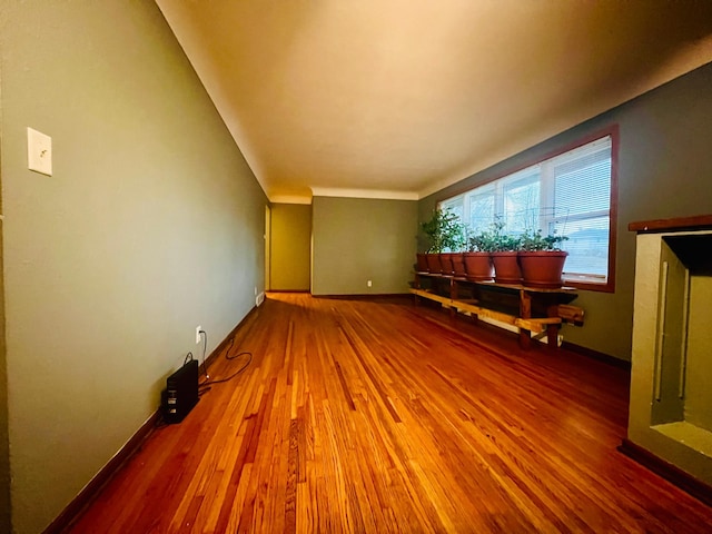 unfurnished living room featuring wood-type flooring