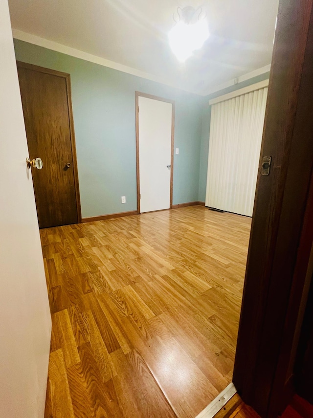 empty room with wood-type flooring