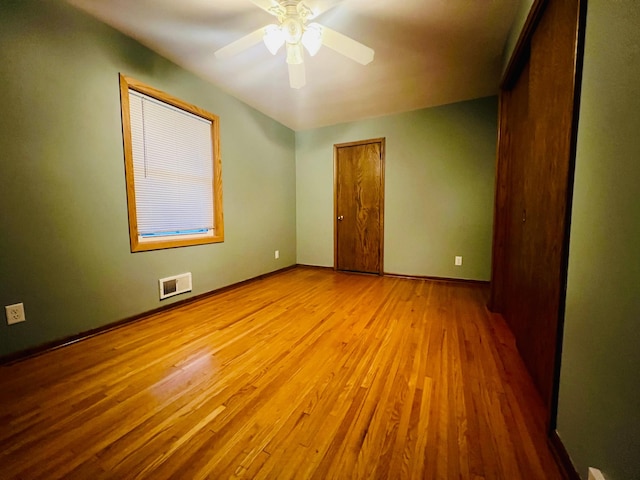 unfurnished room featuring ceiling fan and light hardwood / wood-style floors