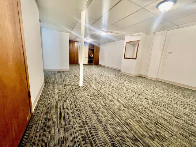 basement featuring a drop ceiling