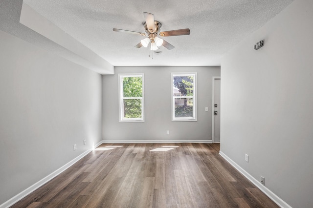 1415 Galtier St, Saint Paul, MN 55117 - unfurnished room with wood finished floors, a ceiling fan, a textured ceiling, and baseboards