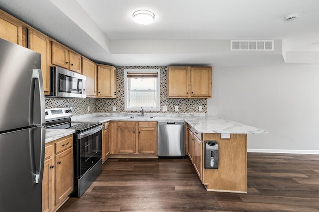 1415 Galtier St, Saint Paul, MN 55117 - kitchen with stainless steel appliances, a peninsula, a sink, baseboards, and dark wood-type flooring