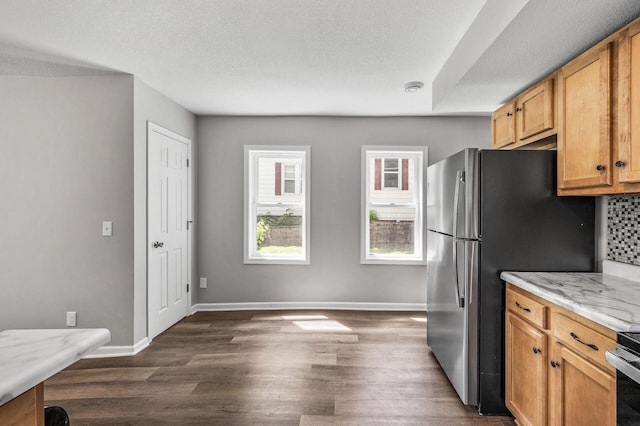 1415 Galtier St, Saint Paul, MN 55117 - kitchen with dark wood-style flooring, baseboards, a textured ceiling, and freestanding refrigerator