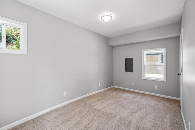 1415 Galtier St, Saint Paul, MN 55117 - unfurnished room with electric panel, plenty of natural light, carpet floors, and baseboards