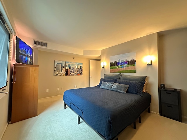 bedroom featuring light carpet