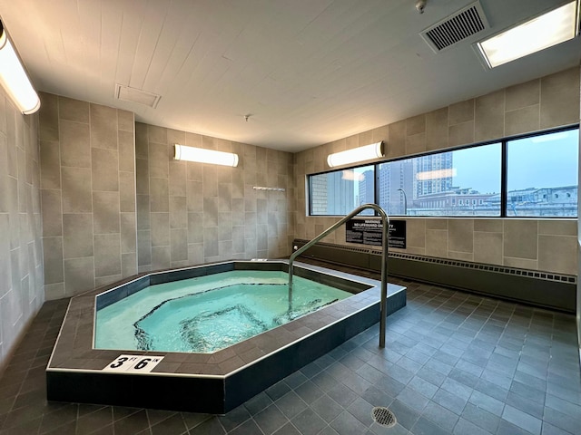 view of pool featuring an indoor in ground hot tub