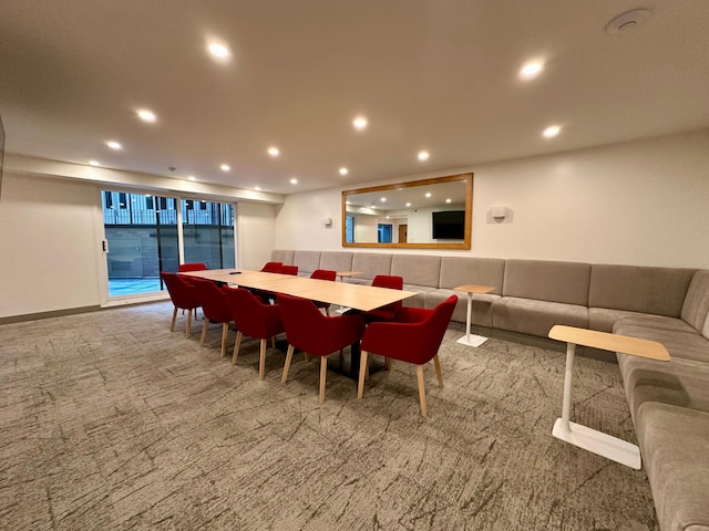 dining space featuring carpet