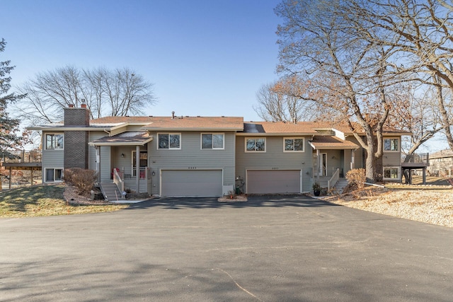 split foyer home featuring a garage