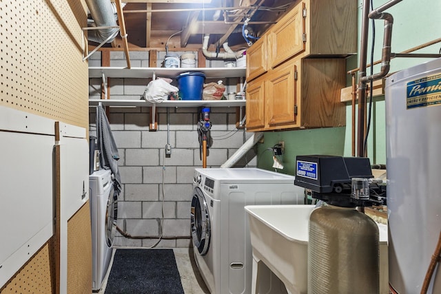 laundry room featuring cabinets and gas water heater