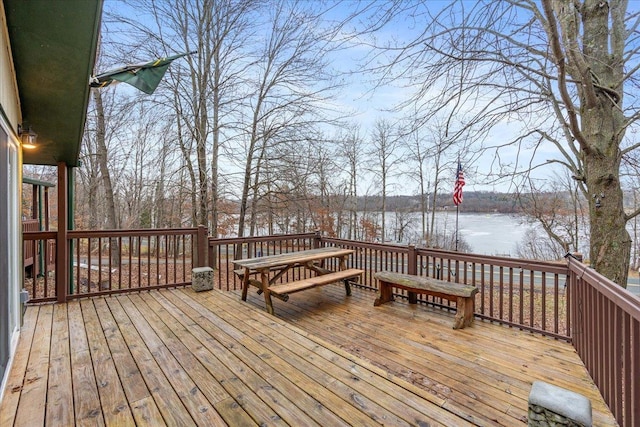 wooden terrace featuring a water view