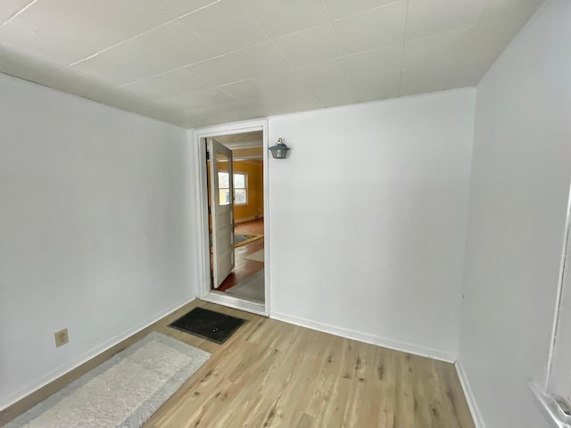 unfurnished room featuring light hardwood / wood-style floors