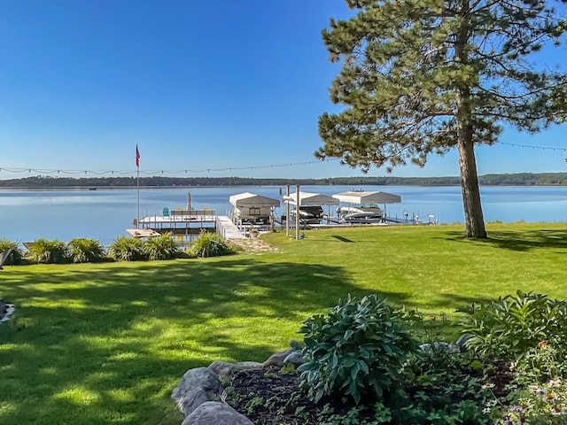 exterior space featuring a yard and a water view