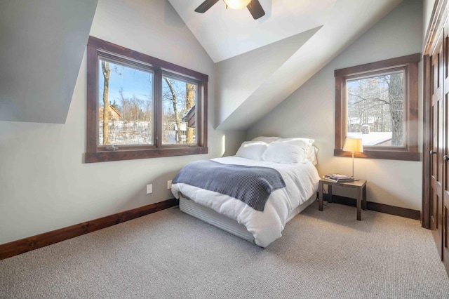 bedroom featuring ceiling fan, lofted ceiling, and light colored carpet