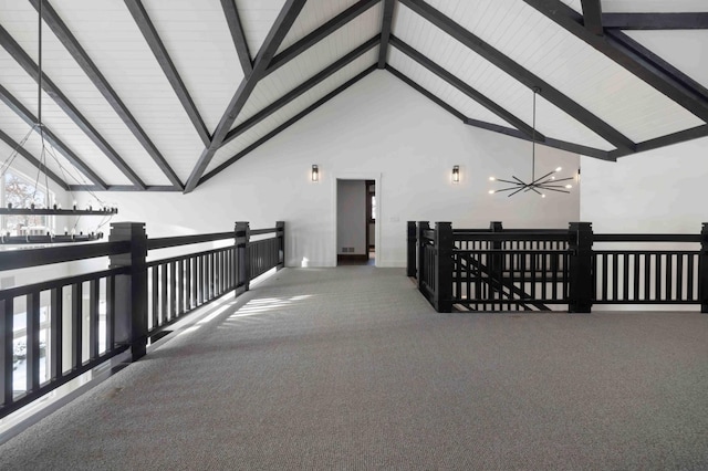 hallway with high vaulted ceiling, carpet, beamed ceiling, and a chandelier