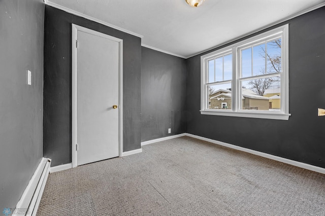 empty room with carpet floors, ornamental molding, and a baseboard radiator