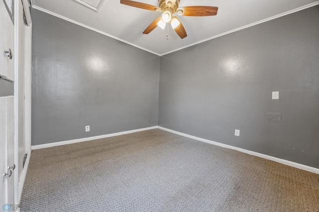 empty room featuring ceiling fan, carpet floors, and ornamental molding