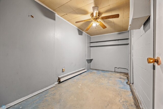 unfurnished bedroom featuring baseboard heating, ceiling fan, and concrete flooring