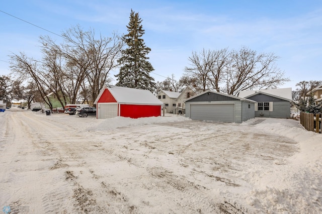 exterior space with an outbuilding and a garage