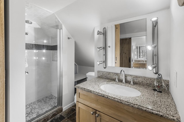 bathroom featuring a stall shower and vanity