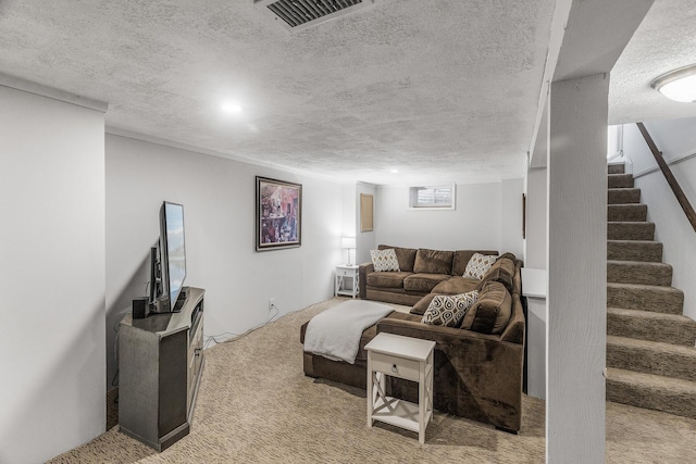 living area featuring light colored carpet, visible vents, a textured ceiling, and stairs