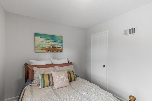 bedroom featuring visible vents