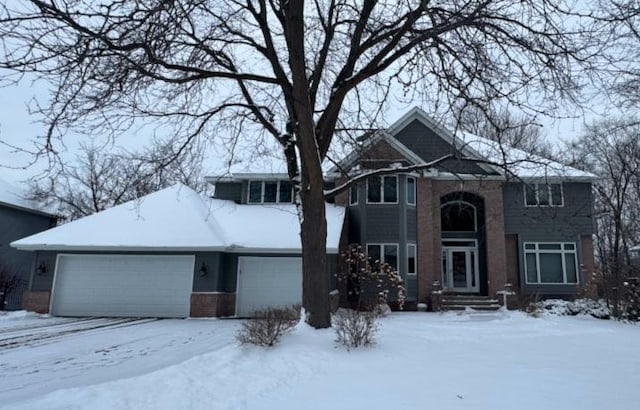 front facade with a garage