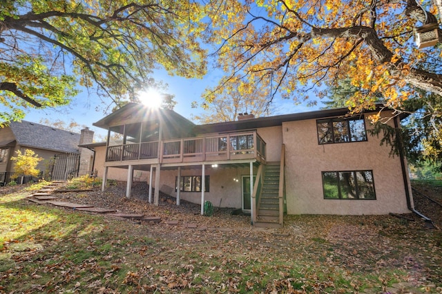 back of property featuring a deck