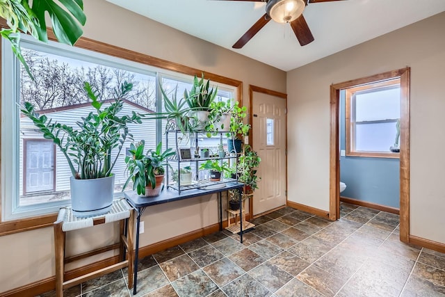 entrance foyer with ceiling fan and a healthy amount of sunlight