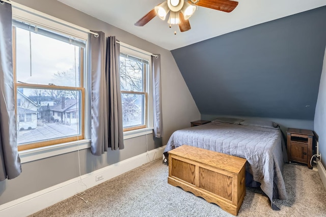 bedroom featuring ceiling fan, carpet floors, and lofted ceiling