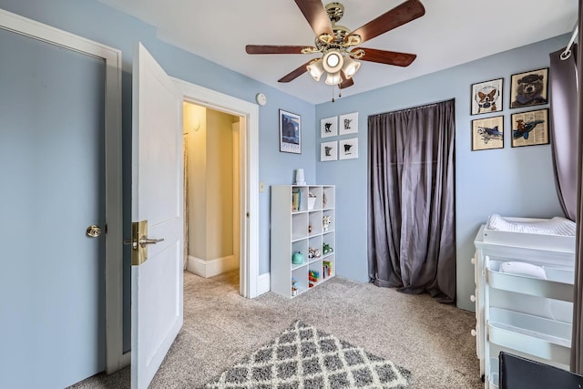 bedroom featuring ceiling fan and light colored carpet