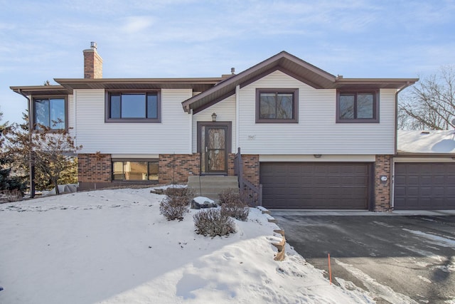 split foyer home featuring a garage