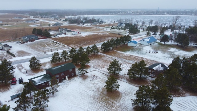 snowy aerial view featuring a rural view