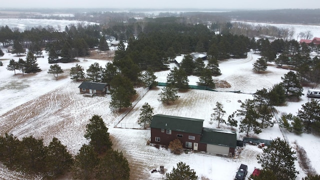 snowy aerial view featuring a rural view