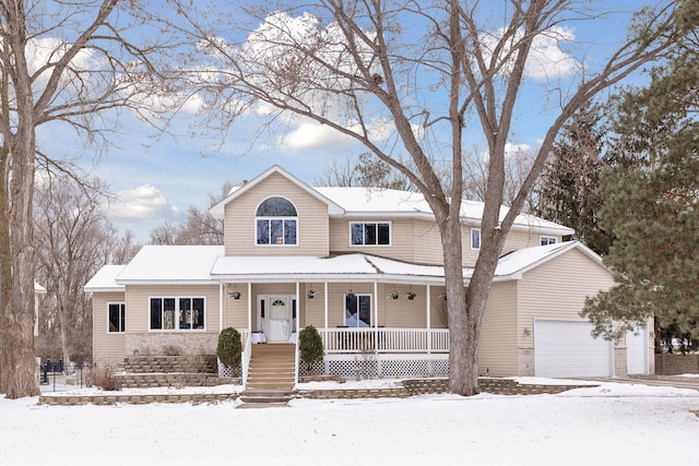 front facade with a garage and covered porch