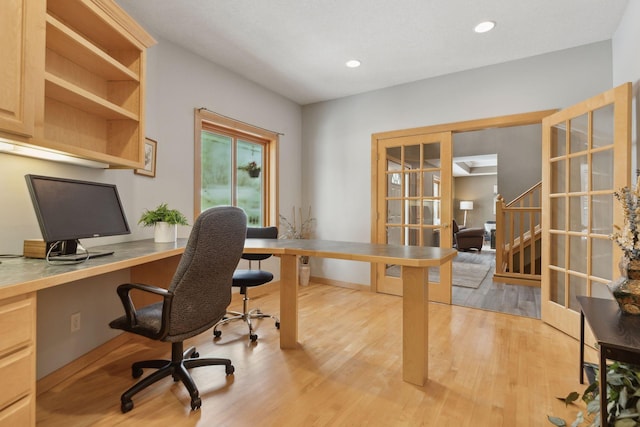 office featuring french doors and light wood-type flooring