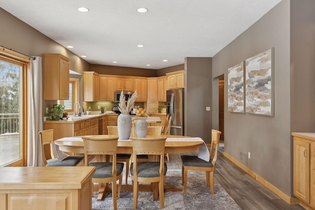 dining room with dark wood-type flooring and sink