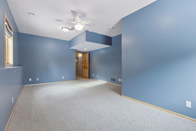 carpeted empty room with ceiling fan