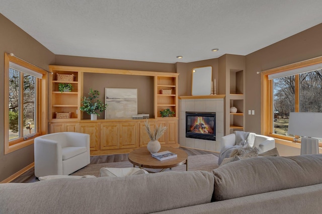 5061 Oxbow Pl, Champlin, MN 55316 - living area with wood finished floors, a fireplace, and built in features