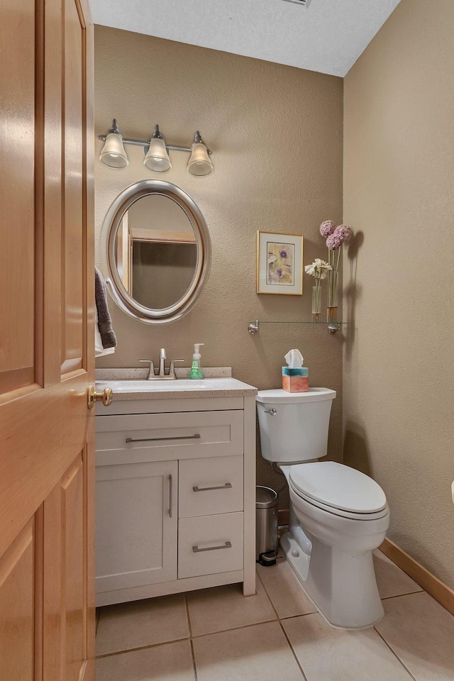 5061 Oxbow Pl, Champlin, MN 55316 - bathroom with vanity, tile patterned floors, and a textured wall