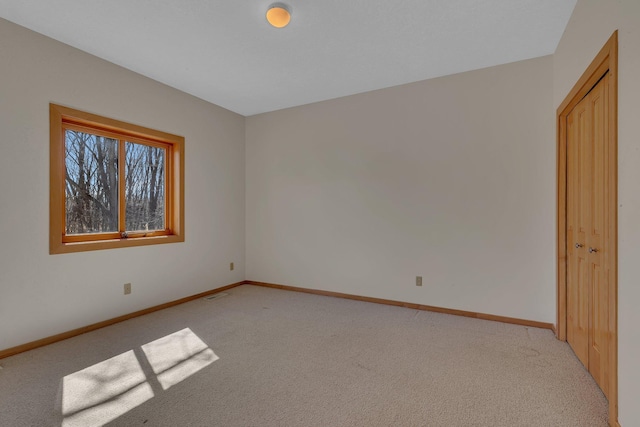 5061 Oxbow Pl, Champlin, MN 55316 - unfurnished bedroom featuring light colored carpet and a closet