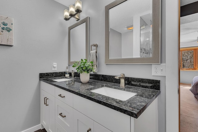 5061 Oxbow Pl, Champlin, MN 55316 - ensuite bathroom featuring double vanity and a ceiling fan