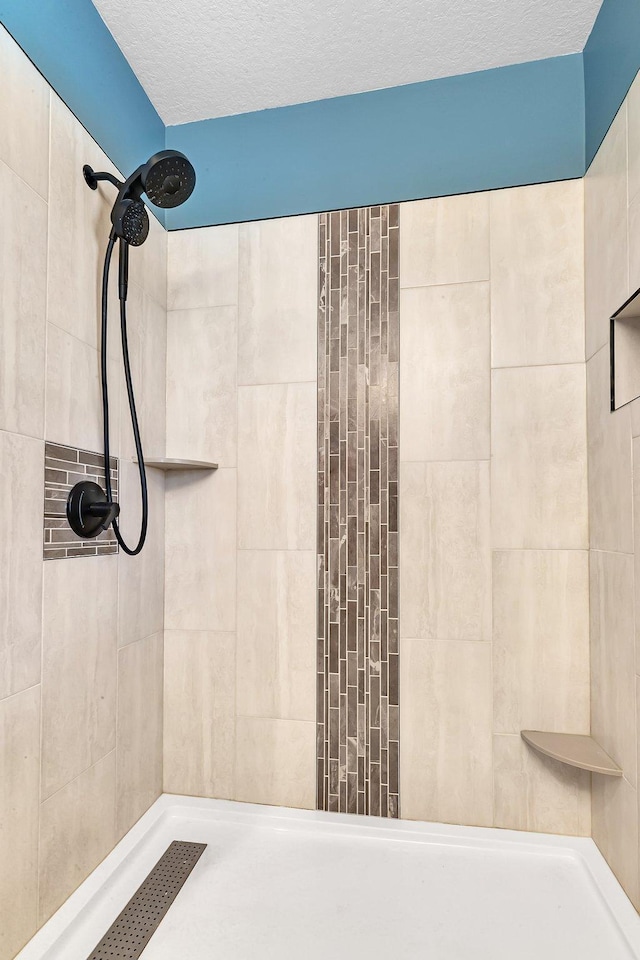 5061 Oxbow Pl, Champlin, MN 55316 - bathroom with tiled shower and a textured ceiling