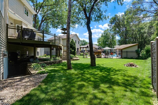 5061 Oxbow Pl, Champlin, MN 55316 - view of yard featuring a wooden deck and stairs