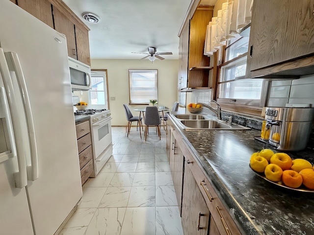 kitchen with ceiling fan, white appliances, and sink